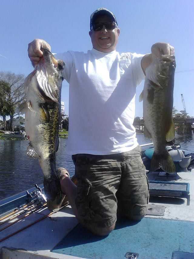 Bobby Choron with a 7.02-pound and 9-pound bass. PHOTO CREDIT: Capt. Eddie Perry.