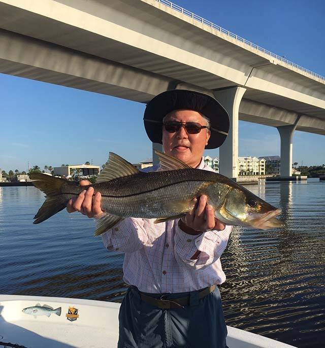 Don Liang with a nice snook caught at the Roosevelt Bridge with Capt. John Young. PHOTO CREDIT: Capt. John Young.