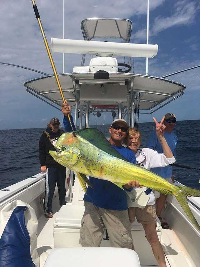 Great grandma CC with her 39-pound bull dolphin she caught while fishing with Capt. Scott Fawcett aboard Off the Chain. PHOTO CREDIT: Off the Chain Fishing Charters.