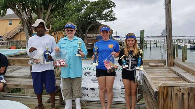 Second place - Ty Walker, third place - Andrew Evans, first place High School Division - Savannah Ward, and first place Middle School Division and biggest fish - Kaitlyn Ward. PHOTO CREDIT: Treasure Coast Casters.