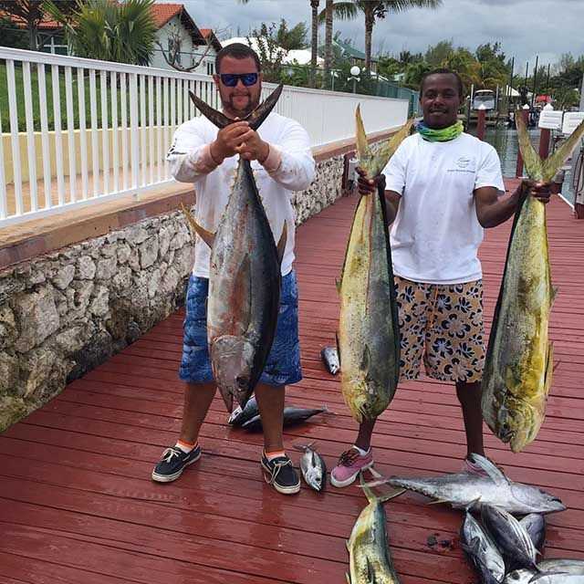 Alex Saunders and Orlando Hanna catching tuna and mahi-mahi onboard "Flyer". PHOTO CREDIT: Capt. Johnaceo "Nay Nay" Saunders.