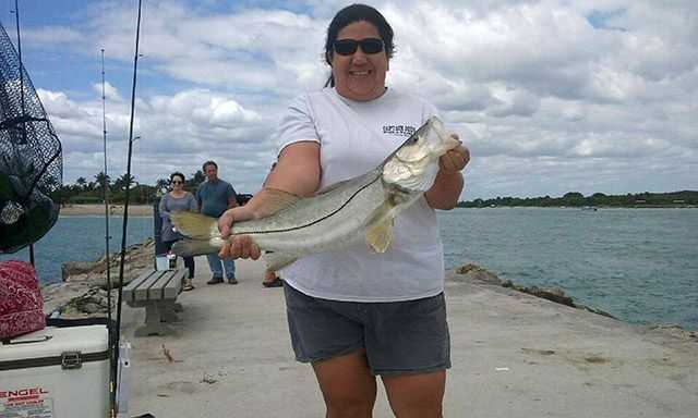 Kara with a 28.5-inch snook caught at the Fort Pierce jetty on a live shrimp. Photo courtesy of Capt. Joe Ward.