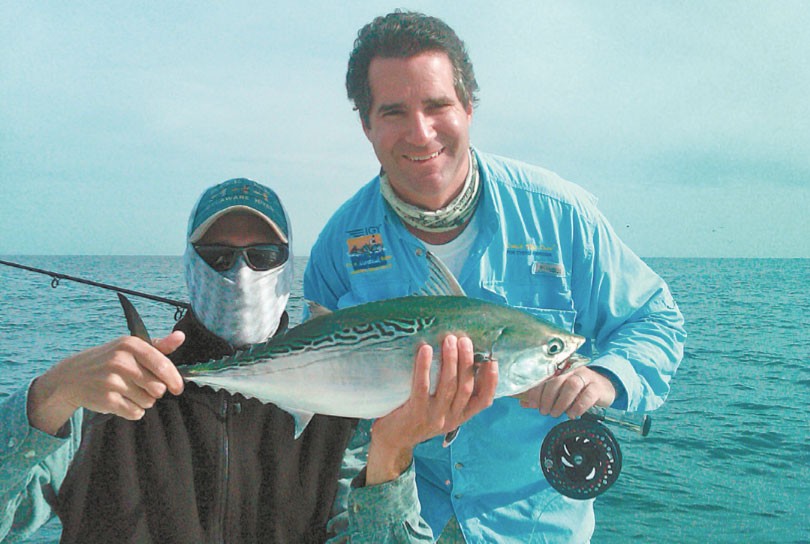 Vinny Catalano of www.longislandflyfishing.com and client Chef Kerry Heernan show off a nice false albacore. Under a sharp summer of fall sun, wearing a bluff to protect your face and neck from the sun is a good idea. Photo courtesy of Capt. Vinny Catalano. 