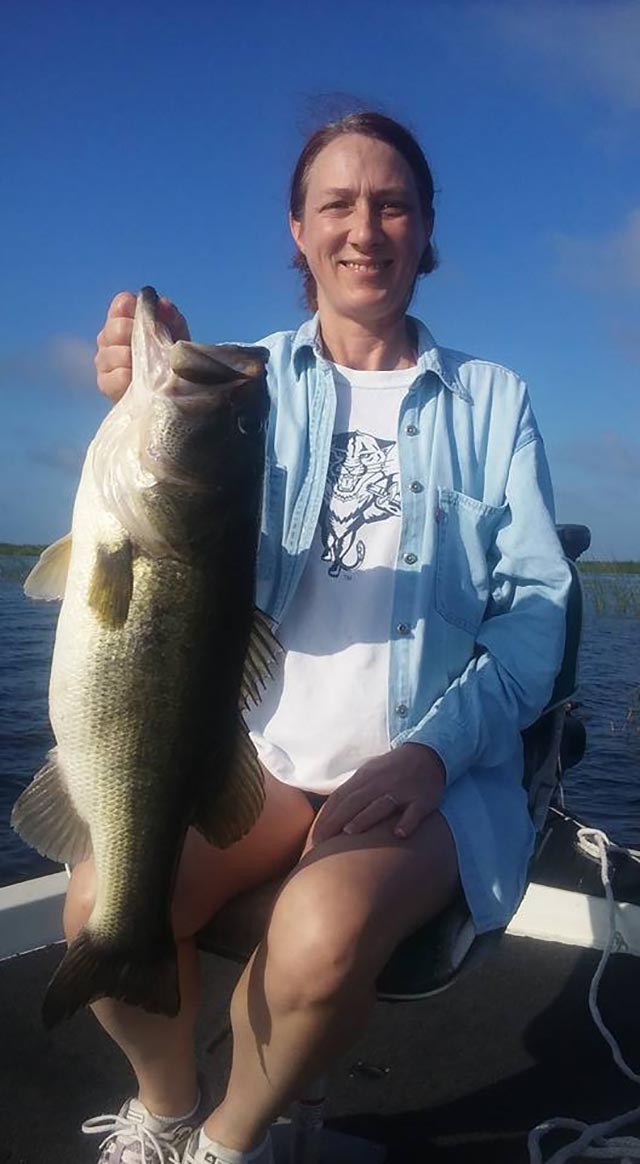 Tanya Carr with an 8-pound bass on a wild shiner. PHOTO CREDIT: Capt. Eddie Perry.