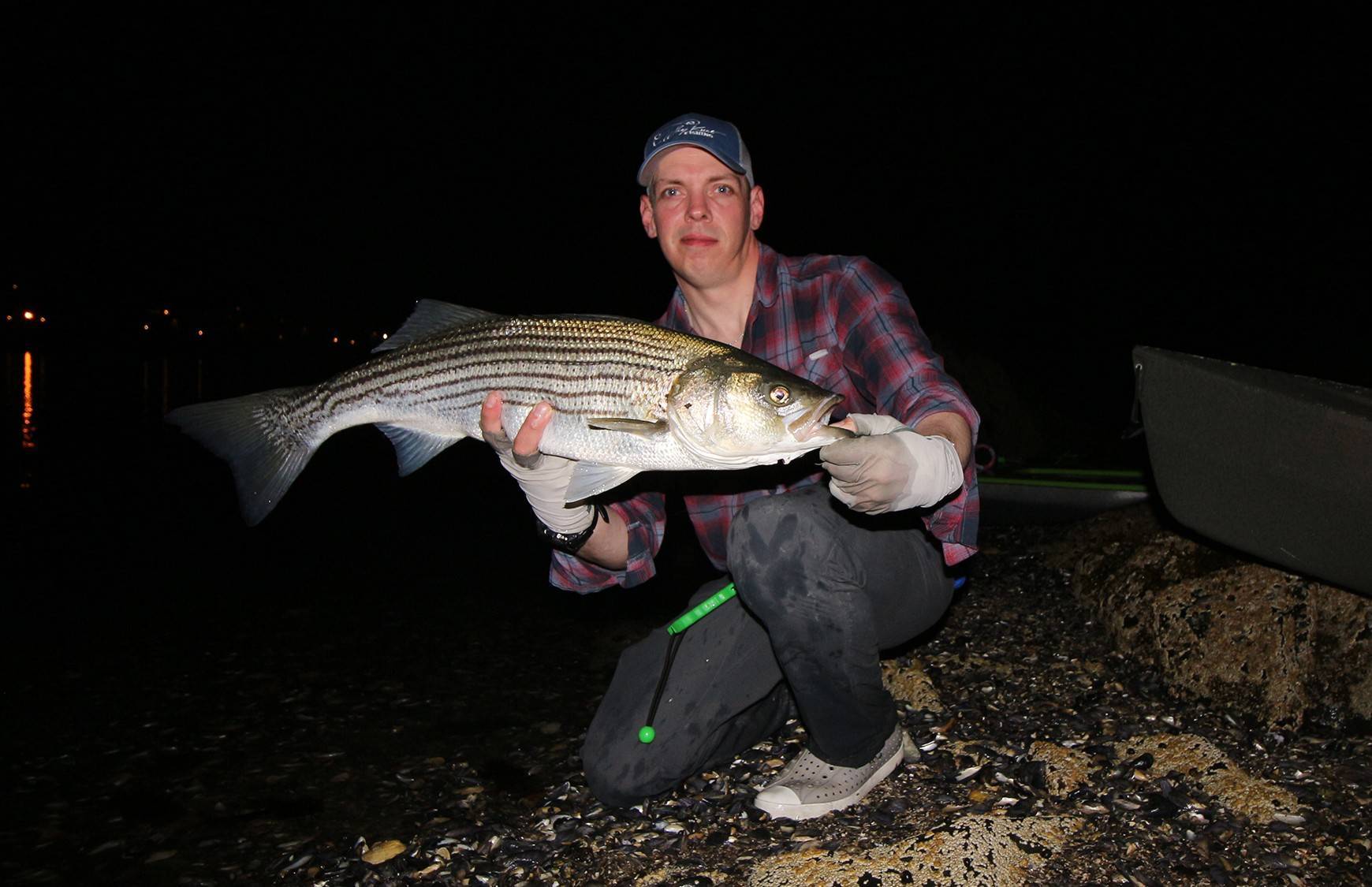 Griffin Dunn with a hefty striper from last July – hoping for another good month.
