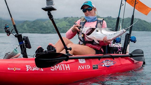 Christina catching her elusive rooster fish. PHOTO CREDIT: Jon Coudriet.