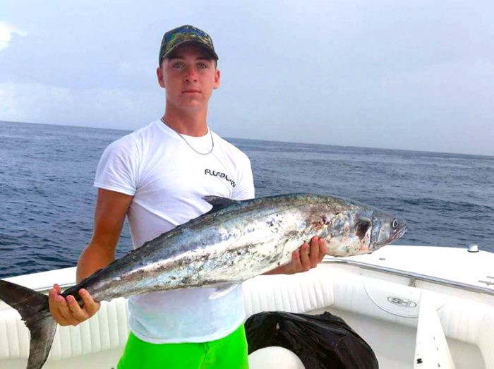 Matt with a 30-pound kingfish caught out of Fprt Pierce inlet in 65 feet of water. This fish was caught on a live blue runner trolled behind a dredge. PHOTO CREDIT: Capt. Danny Markowski/LottaBull Fishing Charters.