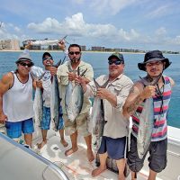 The Garcia boys with a nice catch aboard the Gray Ghost with Capt. Chris Dyer.