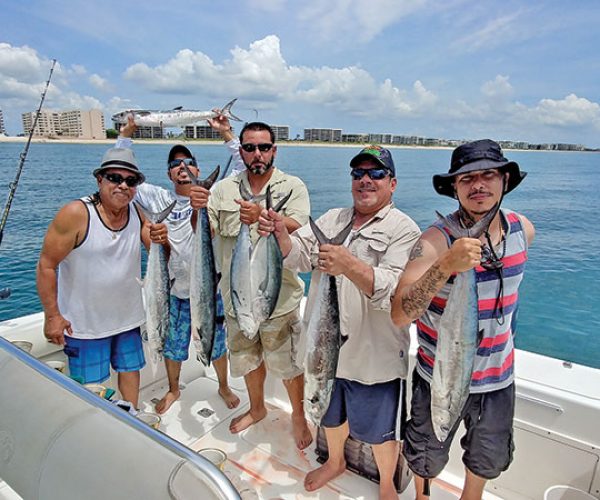 The Garcia boys with a nice catch aboard the Gray Ghost with Capt. Chris Dyer.