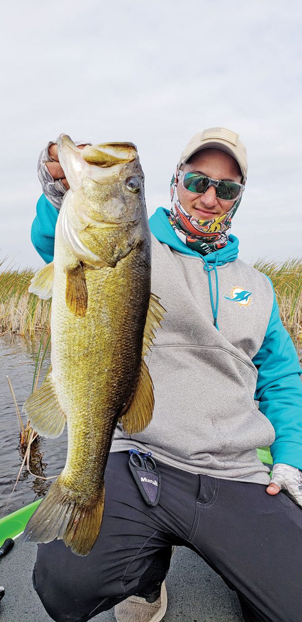 Capt. Drew with a beautiful cold front bass.