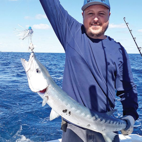 Arthur Tukh of SeaUSmile Lures with a solid barracuda.