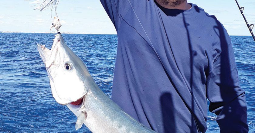 Arthur Tukh of SeaUSmile Lures with a solid barracuda.