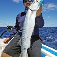 Chris Pascual with a nice barracuda caught on a Mahi Maniacs lure.