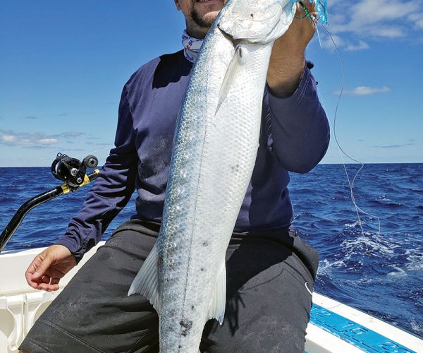 Chris Pascual with a nice barracuda caught on a Mahi Maniacs lure.