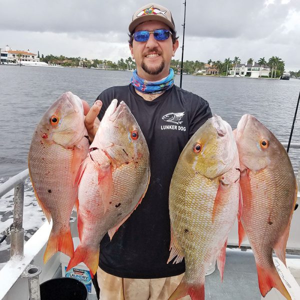 Loyal reader Chris Pascual with four keeper mutton snapper caught on one trip aboard the Catch My Drift.