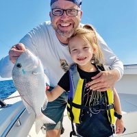 Six year old Brynn Mechler caught a beautiful porgy while fishing with her dad.