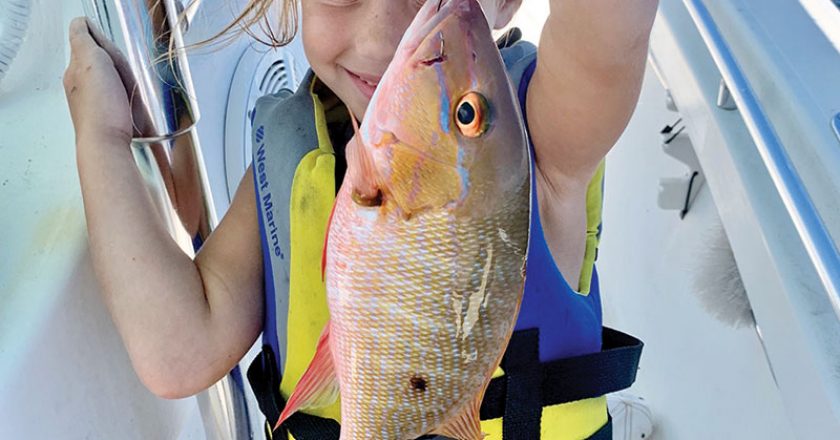 Five-year-old Brooke Mechler caught and released a mutton snapper while fishing with her dad.