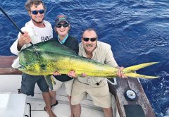 Alex, Pat and Dan with a monster bull dolphin caught fishing with Fishing Headquarters.