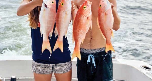 Andrew and Vivian with a nice bunch of snappers caught with New Lattitude Sportfishing.
