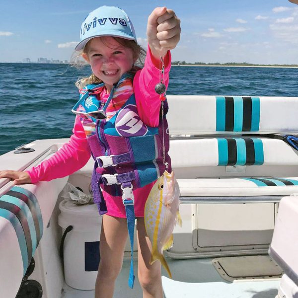 Six-year-old Cambree with her first yellowtail snapper.