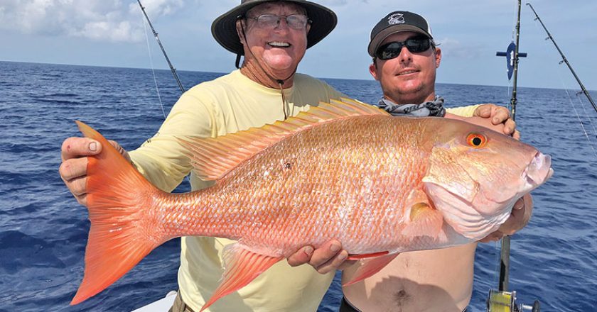 Capt. Paul and Rod with a big mutton snapper caught with Fishing Headquarters.