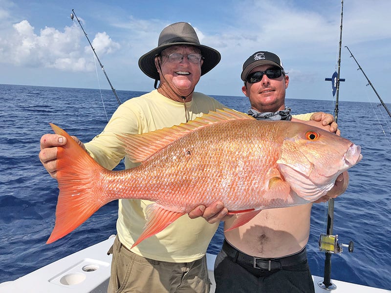 Capt. Paul and Rod with a big mutton snapper caught with Fishing Headquarters.