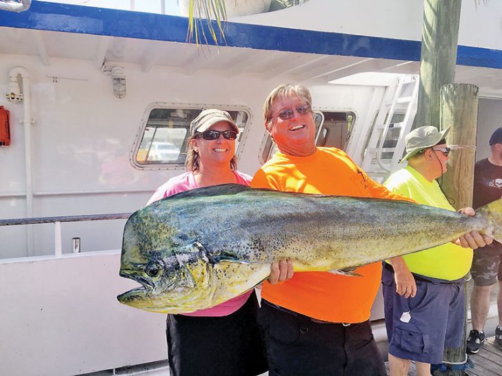 Capt. Paul with a monster bull dolphin caught aboard the Mary B III.