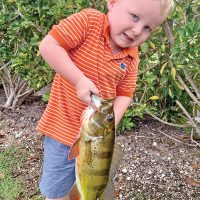 Four year old Bryce Sporrer with his first peacock bass.