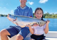 8 year old Isabella and her dad Alex with her first ever clown knife fish.