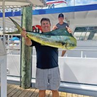 Happy Fishing Headquarters customer with a beautiful mahi mahi.