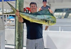 Happy Fishing Headquarters customer with a beautiful mahi mahi.