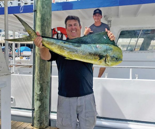 Happy Fishing Headquarters customer with a beautiful mahi mahi.