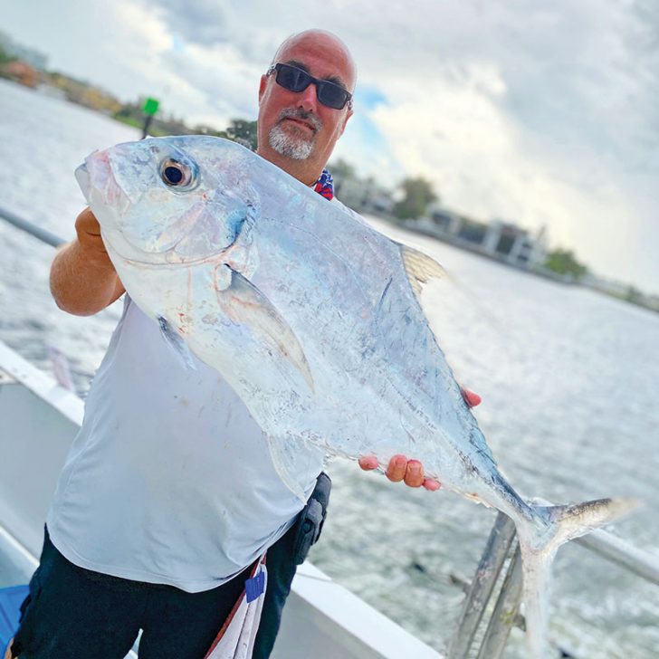 Lucky angler with a tasty African pompano caught aboard the Catch My Drift.