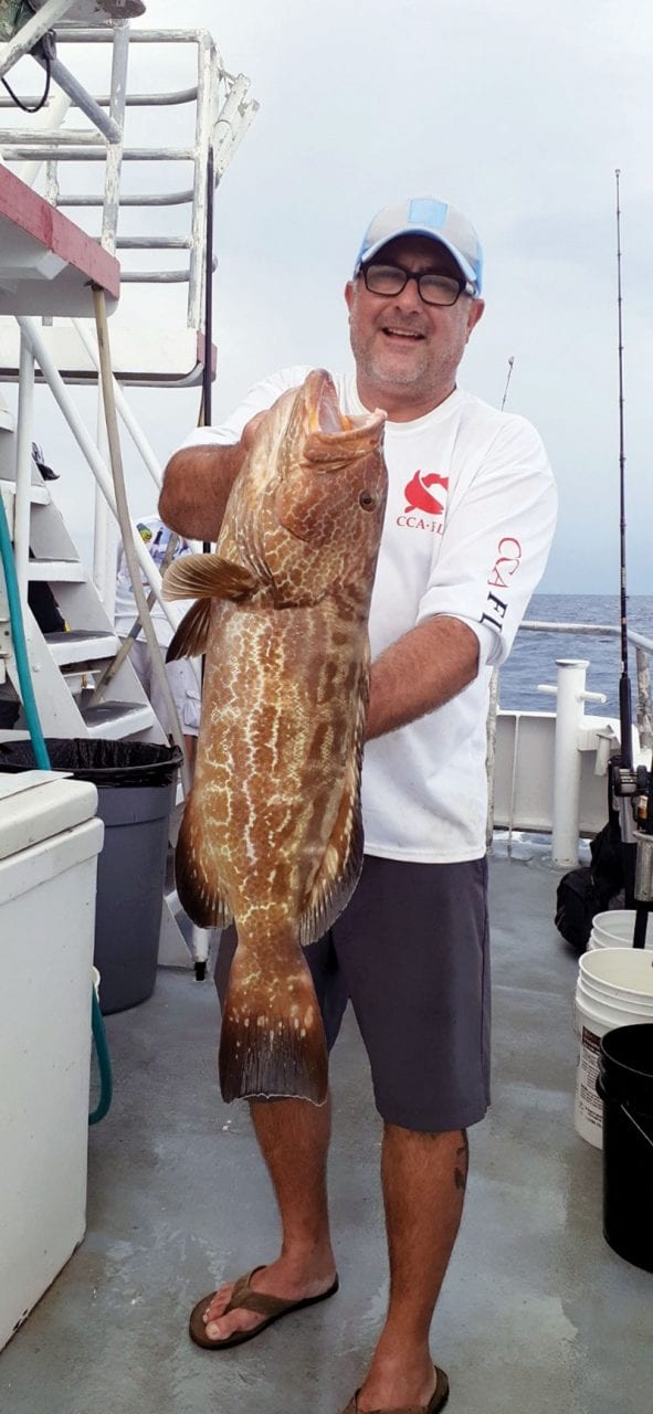 Nice black grouper caught aboard the Catch My Drift.