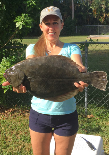 Robin DiMartino with a nice 21-inch flounder she caught at the Fort Pierce jetty. Photo supplied by Capt. Joe Ward.