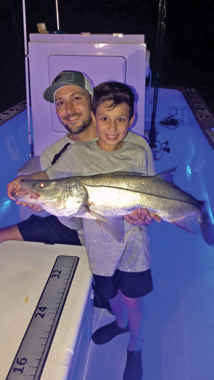 Capt. Ryan put this young angler on his first snook.