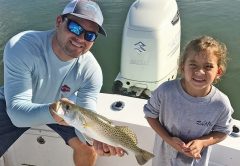 Capt. Ryan put this junior angler on her first seatrout.