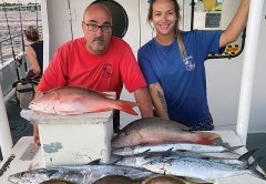 Snapper with a side of mackerel aboard the Catch My Drift.
