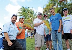 Capt. Neal Stark, left, with veteran participants and FWAF volunteers.