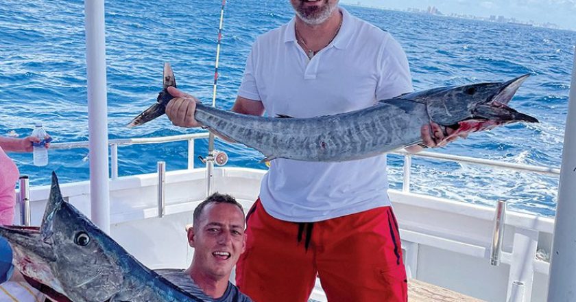 Double header wahoo caught aboard the Catch My Drift.