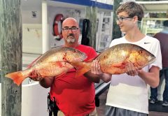 A pair of nice mutton snappers caught aboard the Catch My Drift.
