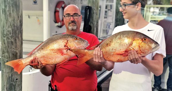 A pair of nice mutton snappers caught aboard the Catch My Drift.