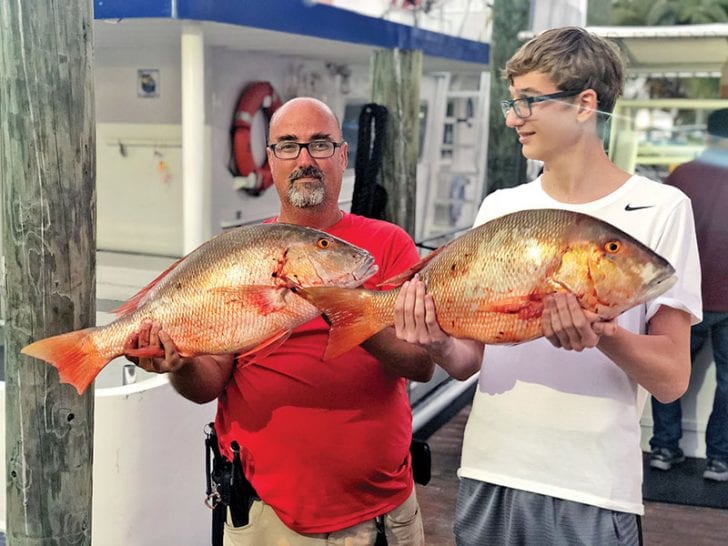 A pair of nice mutton snappers caught aboard the Catch My Drift.