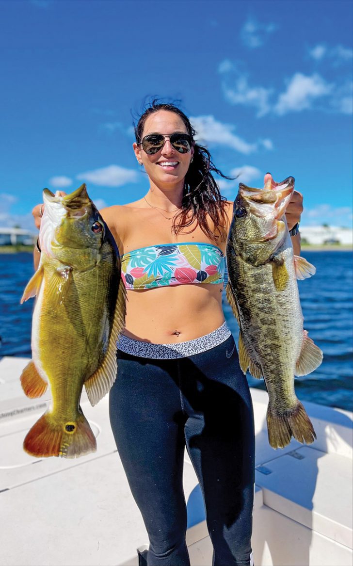 Jennifer Snyder with her personal best largemouth and peacock bass.
