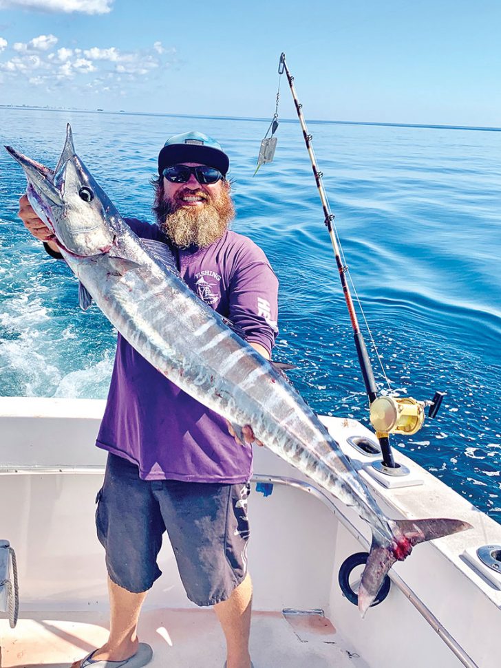 Jimmy with a nice wahoo caught aboard the New Lattitude.