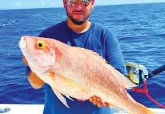 Kenny from Carl's Bait and Tackle with a nice yelloweye snapper.