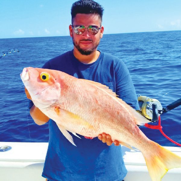 Kenny from Carl's Bait and Tackle with a nice yelloweye snapper.