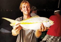 Matt with a nice yellowtail he caught night fishing on Catch My Drift.