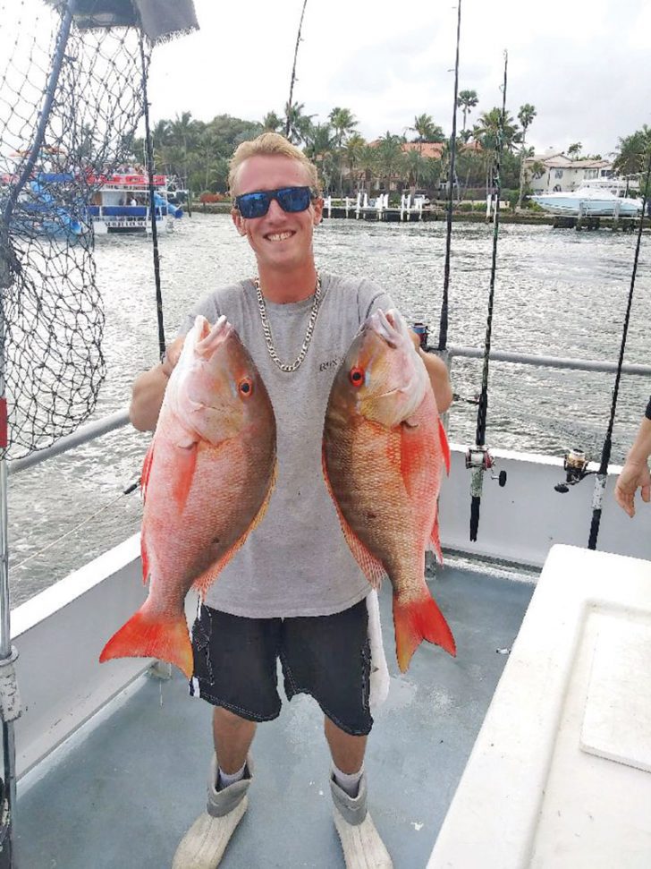 Matt with a pair of nice mutton snapper caught on the Catch My Drift.