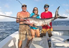 Mick, Kaylee and Nick with a nice swordfish caught with Fishing Headquarters.